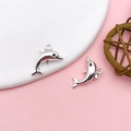 Polished silver dolphin pendant charms for DIY jewelry making and keychains - Antique Silver Alloy Leaping Dolphin Style (10381)