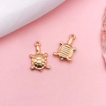 Rose gold turtle pendants for jewelry making with detailed shell texture on pink background - Sea Turtle (18306)