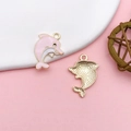 Pink enamel dolphin charm for jewelry making with a golden metal textured reverse side - Pink Enamel Alloy Dolphin Style (16748)