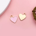 Pink heart-shaped alloy pendant with gold finish for DIY jewelry and necklaces - Pink Heart Shape (15811)