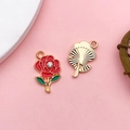 DIY rose pendant with red petals, green leaves, and gold trim for jewelry making - Red Rose With Rhinestone (16690)