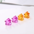 Macro detail of translucent resin star meeple game pieces in purple, pink, yellow and orange - Star Meeple (13*12*8mm) / Colorful