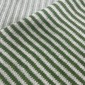 Macro detail of green and white striped knit fabric showing intricate weaving texture - White + Green