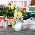 Knitted Easter bunny gnome with carrot and flowers for spring festive home decor - Green
