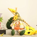 Detail of female autumn gnome plush with sunflower hat and orange checkered skirt - Magic Hat Dangling Leg Gnome Female Style