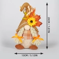 Detail showing dimensions of autumn gnome with sunflower and maple leaf decoration - Female Style