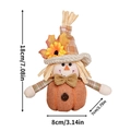 Detail view of autumn gnome with sunflower and maple leaf on orange pumpkin base - Male Style