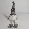 Detail of Christmas gnome plush with gray snowflake hat and striped knit legs - Gray