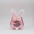 Pink felt Easter bunny basket with floral decor and Happy Easter text on white background - Pink