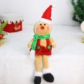 Detailansicht der Lebkuchenmann-Puppe mit rotem Samtkleid und grünem Paillettenschal - Roter Hut Stil