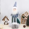Detail of a Christmas gnome doll with telescopic blue striped legs and felt boots - Santa Claus