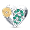 Macro shot of heart-shaped sunflower charm bead with gold plating and green crystals - Leaf Sunflower Heart Shaped Bead