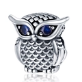 Detail of silver owl charm bead with blue gemstone eyes and intricate feather textures - Retro Textured Owl Style (PAC1023)