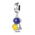 Macro detail of silver astronaut charm with dark blue starry visor and tiny yellow star - Starry Sky Spaceman Charm (PAC430)