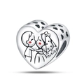 Detail of silver heart charm featuring a cartoon bride and groom kissing with hollow heart sides - Kissing Couple Bead