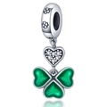 Macro detail of silver clover charm with green enamel petals and zircon heart - Three Hearts Leaf Charm (W-PAC1059)