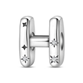 Macro view of silver-plated letter H charm bead with zircon inlay and star patterns - Letter H