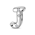 Macro detail of silver letter J charm with inlaid zircons and a black star element - Letter J