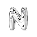 Macro shot of silver letter N charm with sparkling zircons and engraved stars for bracelets - Letter N