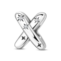 Macro detail of silver letter X charm with sparkling zircon stars and polished finish - Letter X