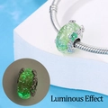 Luminous glass bead charm with silver flower accents on a sleek snake chain bracelet - Luminous Lucky Flower Glass Bead