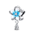 Detail of blue flower charm with gradient enamel, cubic zirconia, and pear-cut stone - Floral Pet Blue Little Flower Charm (PAC591)