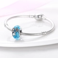 Macro view of blue glass ocean charm with silver starfish details on snake chain - Ocean Blue Glass Bead (W-PAC447)