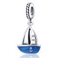 Detailed macro view of silver sailboat charm with blue enamel coating and small white zircons - Yacht Style (W-PAC065)