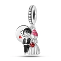Macro detail of S925 silver wedding charm with bride, groom and heart engraving - Wedding Couple Backdrop Pendant