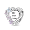 Detailed view of silver heart pendant with enamel stars and My Best sister engraving - Sisterhood