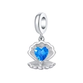 Macro shot of silver shell charm with heart-shaped blue gemstone and micro zircons - Blue Heart Shell Charm (OTC1048)