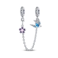 Macro shot of silver safety chain with blue bird and purple enamel flower charms - Swallow Safety Chain
