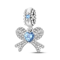 Macro detail of silver-plated bow charm with heart blue stone and pave zirconias - Full Zirconia Bowknot (PAC1545)