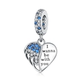 Detailed view of silver heart wing charm with blue zircons and engraved text - Heart-shaped Hollow Blue Zirconia Wings Pendant (OTC1057)