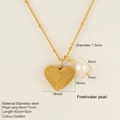 Golden stainless steel heart wing necklace with white freshwater pearl and beaded chain - Heart
