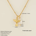 Golden stainless steel hummingbird necklace featuring a freshwater pearl and adjustable chain - Bird