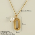 Golden stainless steel necklace featuring a textured oval pendant and a white drop pearl - Oval Pendant