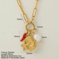 Collana a graffetta dorata con ciondoli a peperoncino rosso, conchiglia, stella e perla - Stella Marina Conca