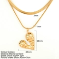 Golden double-layer stainless steel necklace featuring a textured heart pendant and snake chain - Waterdrop Heart