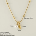 Gold stainless steel starfish necklace featuring a white pearl and dolphin pendant charm - Small Shark (25163G)