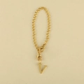 Gold chain bracelet with letter V pendant and lobster clasps on a beige surface - Cup Chain Letter-V