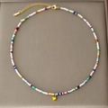 Bohemian colorful seed bead necklace with a golden heart pendant and adjustable chain - Yellow Heart
