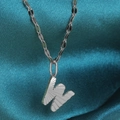 Polished silver stainless steel necklace featuring a radial-textured letter W pendant - Letter W / Silver