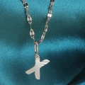 Silver-colored alphabet X letter pendant necklace with textured radiant finish on thin chain - Letter X / Silver