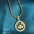 Golden Cancer zodiac pendant necklace with clear crystals on a blue silk background - Cancer