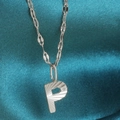 Minimalist silver stainless steel pendant necklace featuring capital letter P with ray texture - Letter P / Silver
