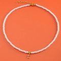Elegant 18K gold plated pearl necklace featuring a golden cursive letter T pendant - Letter X (NK228ZP39270-2)