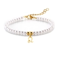 Pulsera de perlas blancas con colgante signo Leo dorado y cierre ajustable - Leo