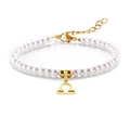 Elegante pulsera de perlas con colgante de signo Libra dorado y cierre ajustable - Libra