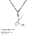 Collana in acciaio inox argento con ciondolo lettera K corsiva e dettaglio cuore - K-Acciaio